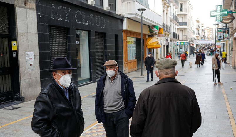 Pensioners wearing protective face masks